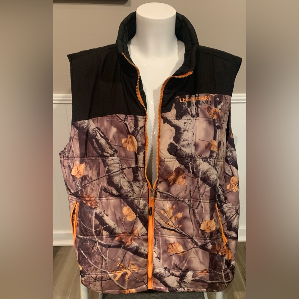 Legendary Whitetails sleeveless camo vest. Zip up and zipper side pockets.